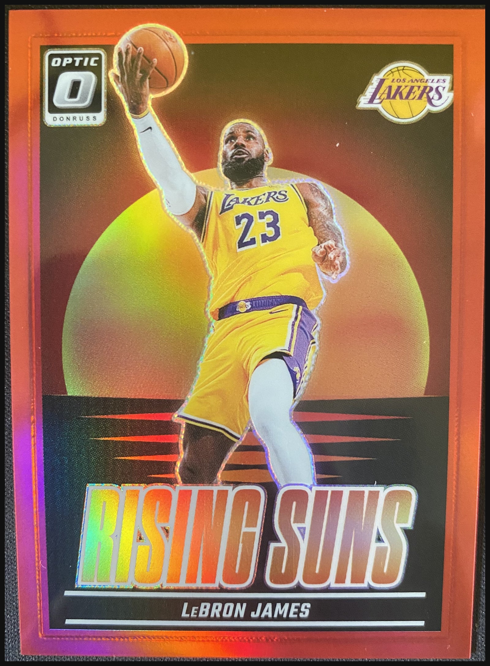 LEBRON JAMES 2024/25 Panini Donruss Optic Rising Suns Red Prizm #2 58/99 - front